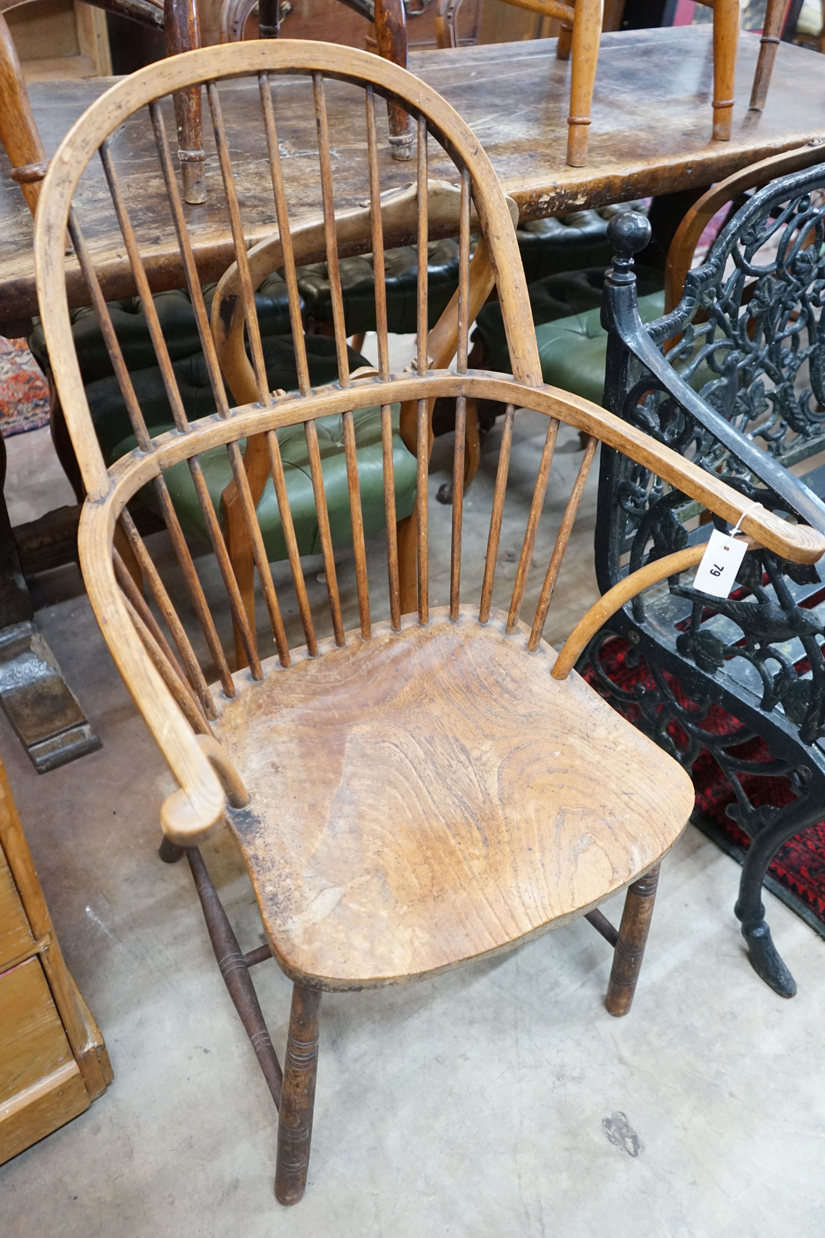 A late 19th / early 20th century elm and beech Windsor comb back elbow chair, width 64cm, depth 43cm, height 104cm